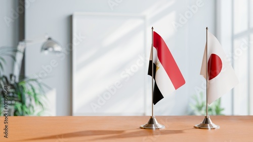 FLAGS OF EGYPT AND JAPAN ON TABLE