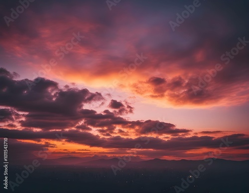 Dramatic fantasy scene after sunset, dusk with red and purple sky, city lights with distant mountains