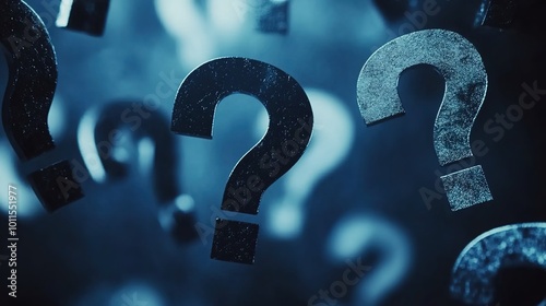Cinematic, dark blue background with question marks floating in the air photo