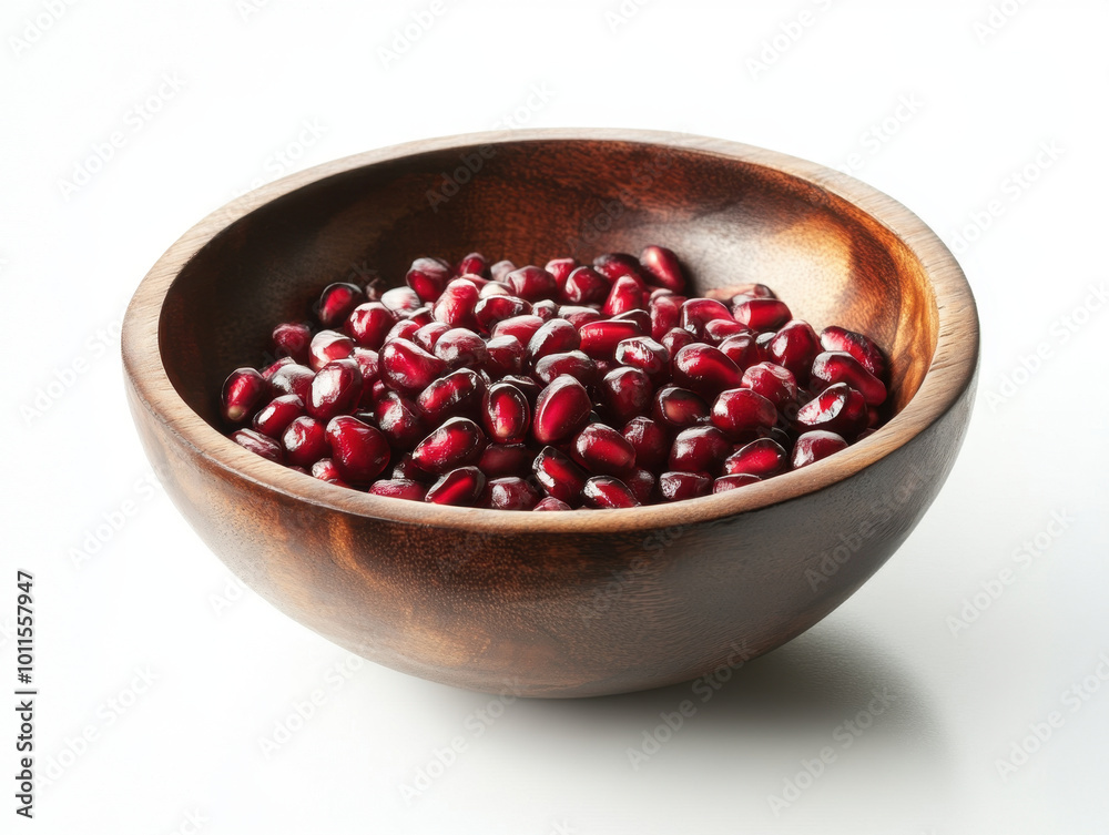 A vibrant bowl of ruby-red pomegranate seeds resting on a delicate floral tablecloth in sunlight A vibrant bowl of ruby-red pomegranate seeds resting on a delicate floral tablecloth in sunlight