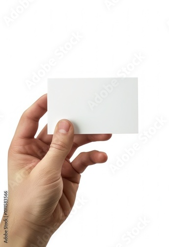 Hand holding a blank business card, isolated on white background