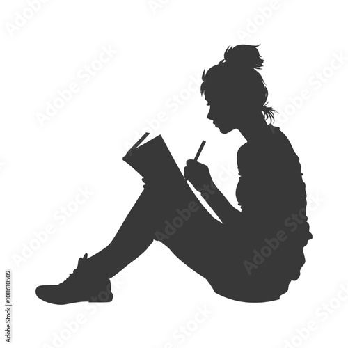 Silhouette of a woman writing in a book