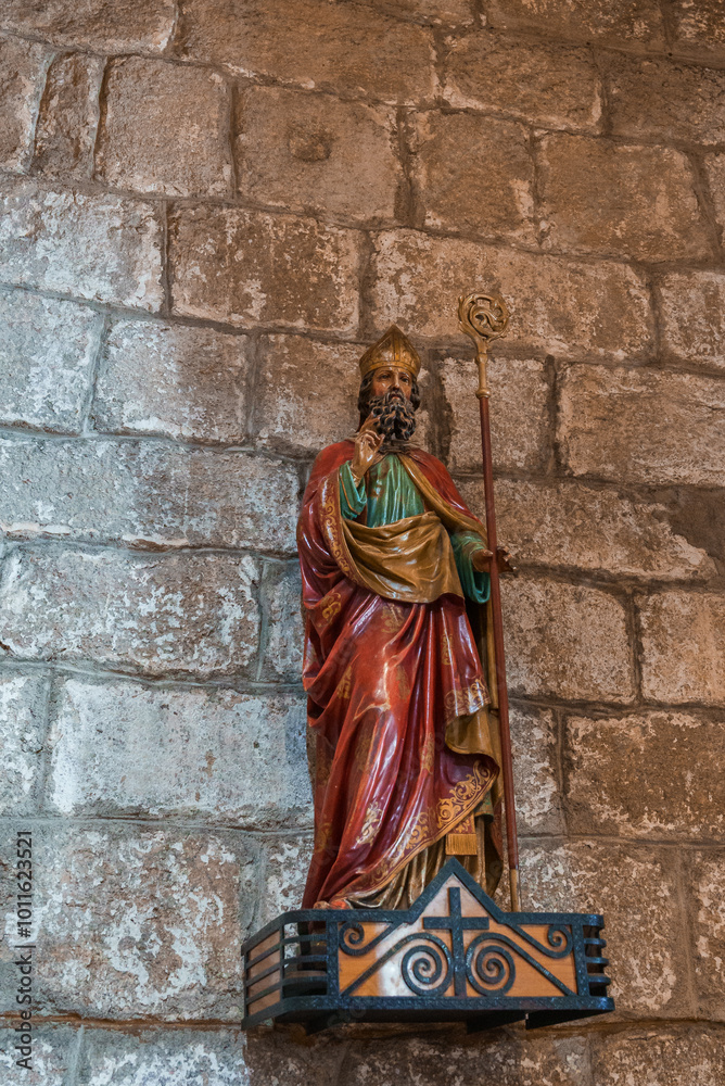 Fototapeta premium Intricate Statue of a Saint in a Historic Sardinian Church Interior