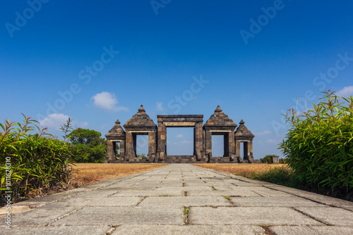 View entrance gate of Ratu Boko temple or called Keraton Ratu Boko at the morning, sky blue photo