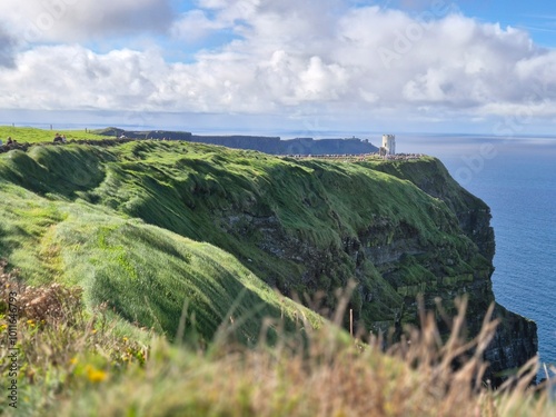 Rugged Green Cliffs Of Moher Overlooking Ocean Waves, Ireland