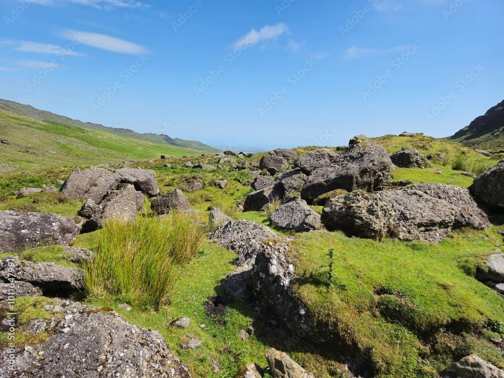 Scenic Summer Landscape Of Green Hills And Rocky Mountains In Ireland Scenic Summer Landscape Of Green Hills And Rocky Mountains In Ireland
