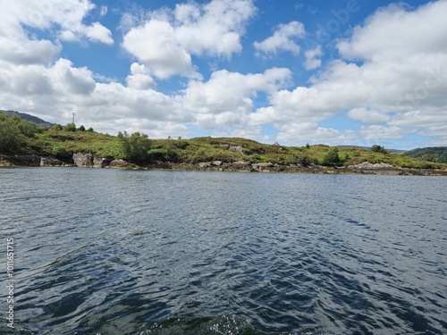 Tranquil River Landscape With Cloud Reflections And Gentle Waves