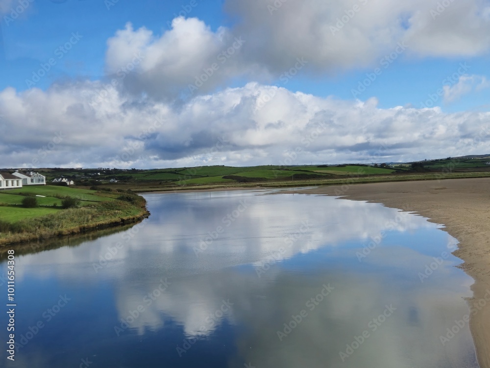 Serene River Waterscape With Little Waves And Cloud Reflections Serene River Waterscape With Little Waves And Cloud Reflections