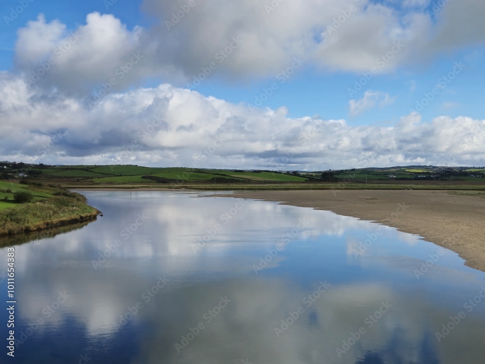 Tranquil River Waterscape With Little Waves And Cloud Reflections Tranquil River Waterscape With Little Waves And Cloud Reflections