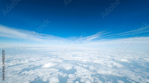 A wide, open sky with vivid blue tones, minimal clouds, and a feeling of endless space and freedom 