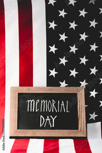 A tribute on Memorial Day, featuring a chalkboard sign and the vibrant American flag, symbolizing honor.