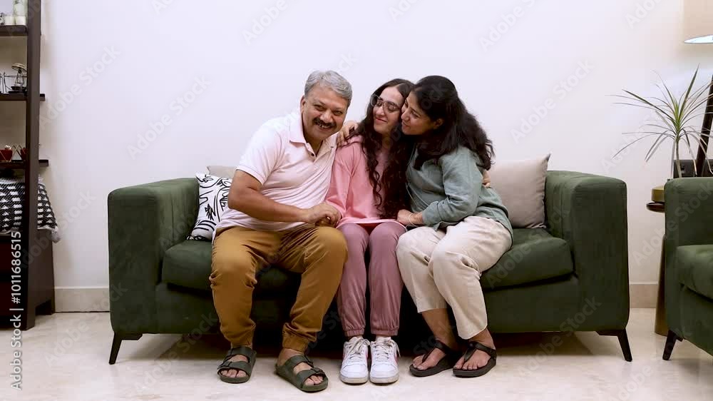 Happy Indian Family Bonding on Couch - Parents and Daughter Together
Happy Indian Family Bonding on Couch - Parents and Daughter Together