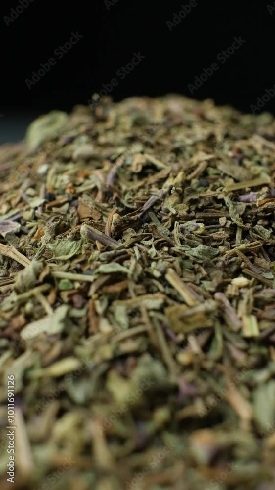 Macro Vertical Rotation of Dried Basil Seasoning Macro Vertical Rotation of Dried Basil Seasoning