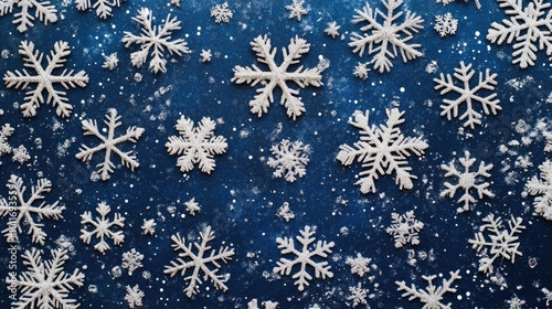 Shimmering Christmas snowflake background with silver and white snowflakes on a deep blue gradient, ideal for festive designs.