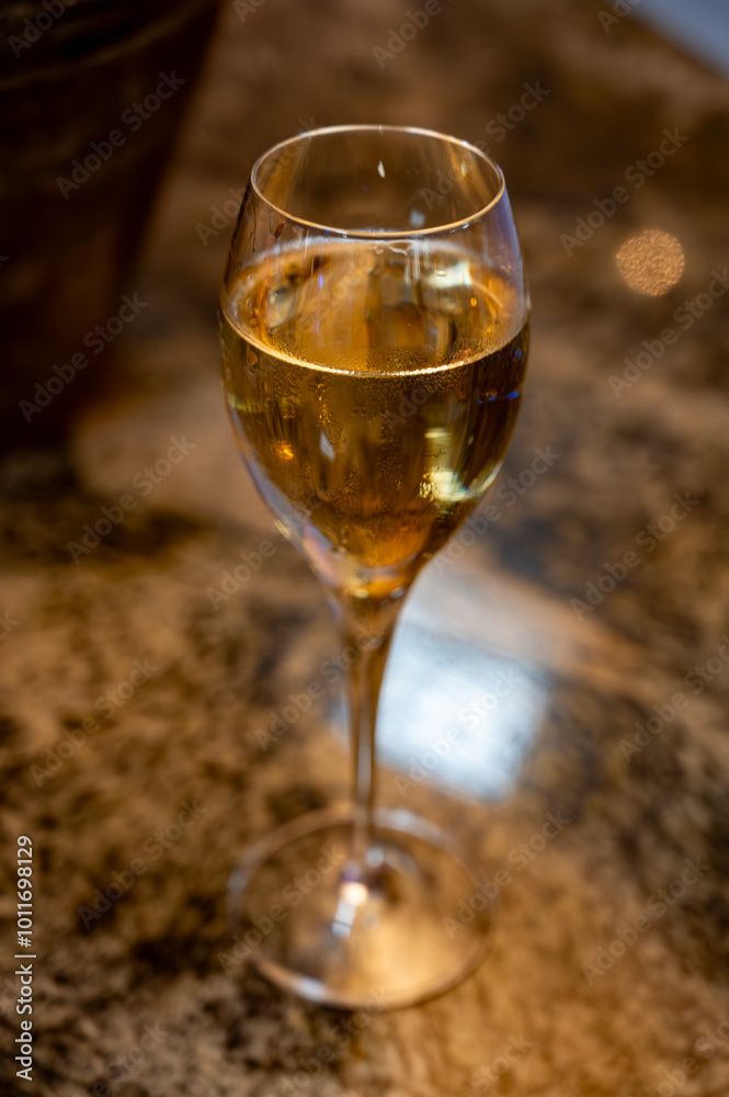 Tasting of brut and reserve grand cru champagne sparkling wine produced by traditional method in underground caves in Champagne, France, close up Tasting of brut and reserve grand cru champagne sparkling wine produced by traditional method in underground caves in Champagne, France, close up
