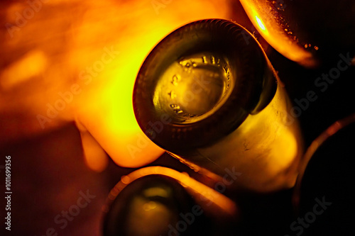 Champagne bottles on pupitre riddling racks in deep and long underground caves, making champagne sparkling wine in Reims, Champagne, France photo