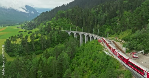 Aerial viw Landwasser Viaduct world and Bernina express summer scenery. Railway scenic route in Switzerland