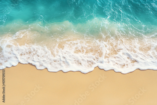 Beautiful beach with soft waves on a sandy background, top view.