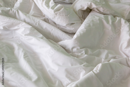 wrinkle messy blanket after waking up in the morning from sleeping in a long night, details of duvet and blanket.