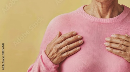 Wallpaper Mural Close-up of hands on pink sweater, warm background highlighting gentle touch. Torontodigital.ca