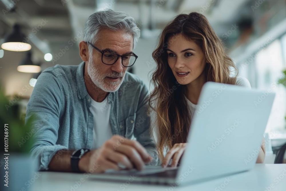 Young trainee discussing about data with mature business mentor who is using laptop in the office, Generative AI Young trainee discussing about data with mature business mentor who is using laptop in the office, Generative AI