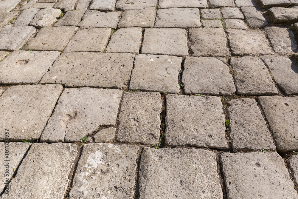 Ancient court lined with stone slabs in sunny weather Ancient court lined with stone slabs in sunny weather