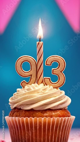 Birthday cupcake with burning lit candle with number 93. Number ninety-three for ninety-three years or ninety-third anniversary. photo