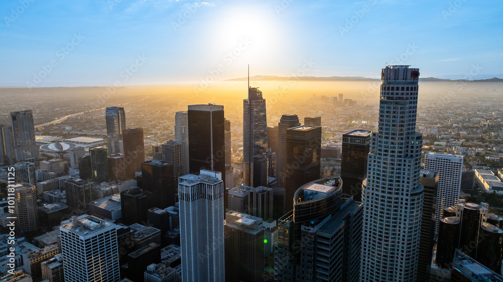 Varied architecture in the downtown of Los Angeles, California, United States. Vast cityscape is dazzled with bright sunlight. Top view. Varied architecture in the downtown of Los Angeles, California, United States. Vast cityscape is dazzled with bright sunlight. Top view.