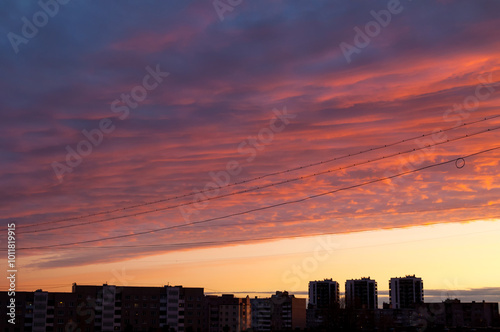 Sky background, sunset sky landscape and modern city houses at the horizon, urban city sky landscape view. Sunset sky in the city