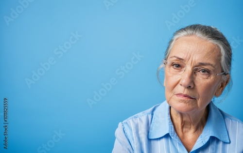 portrait of senior sad person on a blue background