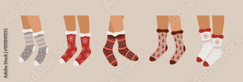 Set of feet in Christmas socks. Flat vector illustration