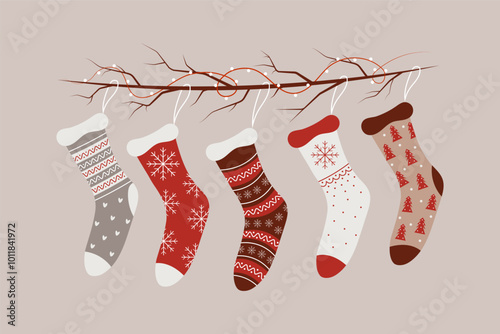 Set of Christmas socks on a branch with a garland. Flat vector illustration