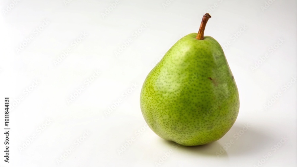 A single green pear isolated on a white background. A single green pear isolated on a white background.