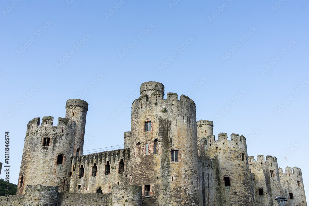 parapets, towers and turrets of Conwy Castle under blue sky. parapets, towers and turrets of Conwy Castle under blue sky.