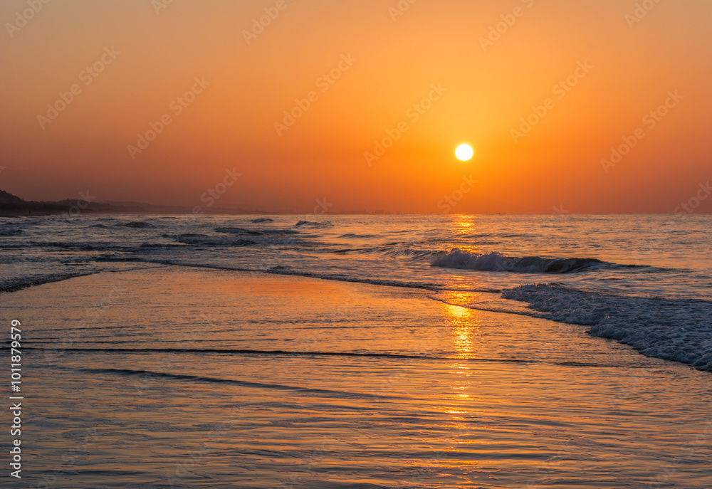 Dramatic sunset sea, clouds and beautiful orange sky, sandy beach and calm waves, Beauty landscape view of sea coast, Closeup sea beach,Calm tranquil relax summer tropical in mediterranean sea Algeria Dramatic sunset sea, clouds and beautiful orange sky, sandy beach and calm waves, Beauty landscape view of sea coast, Closeup sea beach,Calm tranquil relax summer tropical in mediterranean sea Algeria