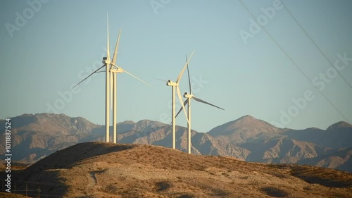 Wind turbines renewable energy on hillside 