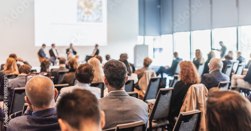 Interview and round table discussion at business convention and presentation. Audience at the conference hall. Business and entrepreneurship symposium.