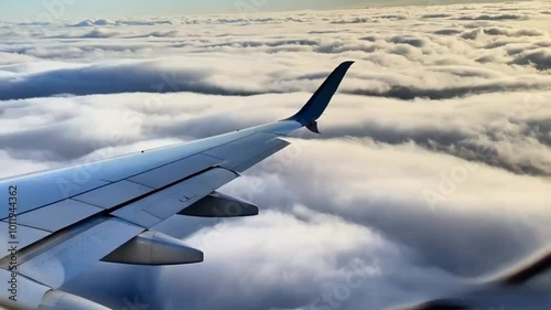 Aircraft wing under the earth and clouds. Flight in sky, small plane wing, plane wing sunset, plane front, plane window, plane engine