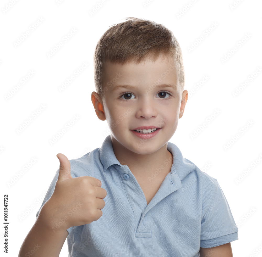 Cute little boy showing thumbs up on white background Cute little boy showing thumbs up on white background