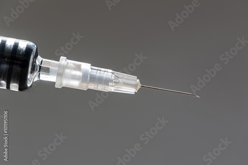 Detail of medical needle with vaccine to be given