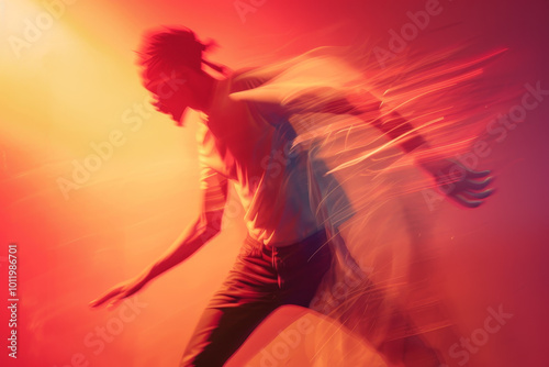 A man is running in a blurry photo with a red background