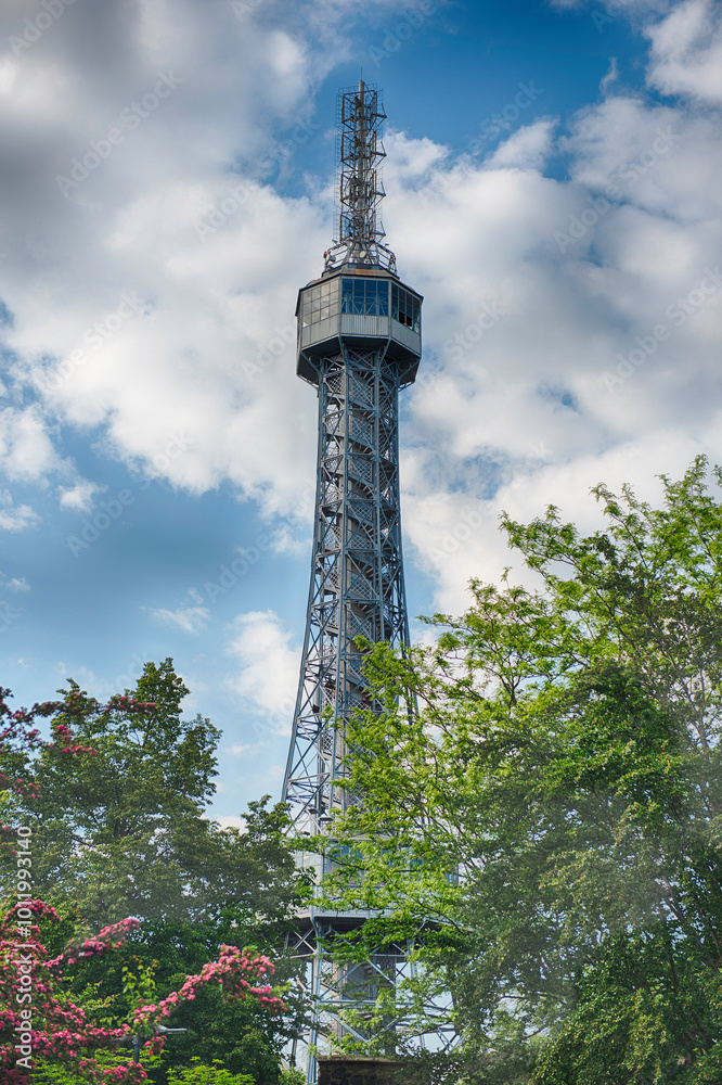 Obraz premium Petrin lookout tower rising above trees in Prague, Czech Republic
