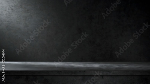 Illuminated concrete table in a studio, ready for product display, against a black wall, showcasing a minimalist design.