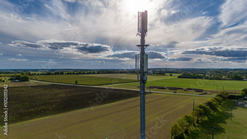 Photos 5G Tower in Scenic Rural Landscape with Dramatic Sky