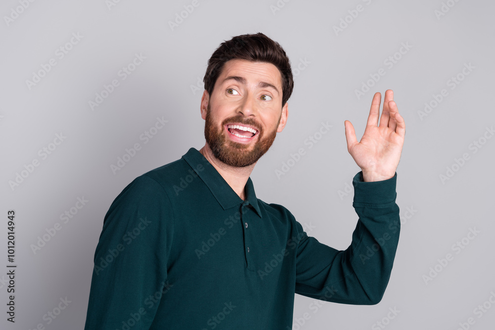 Photo of cheerful attractive nice man wear stylish green clothes look empty space isolated on gray color background Photo of cheerful attractive nice man wear stylish green clothes look empty space isolated on gray color background