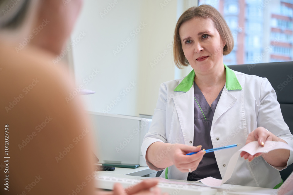 Doctor explaining medical procedure to a patient Doctor explaining medical procedure to a patient