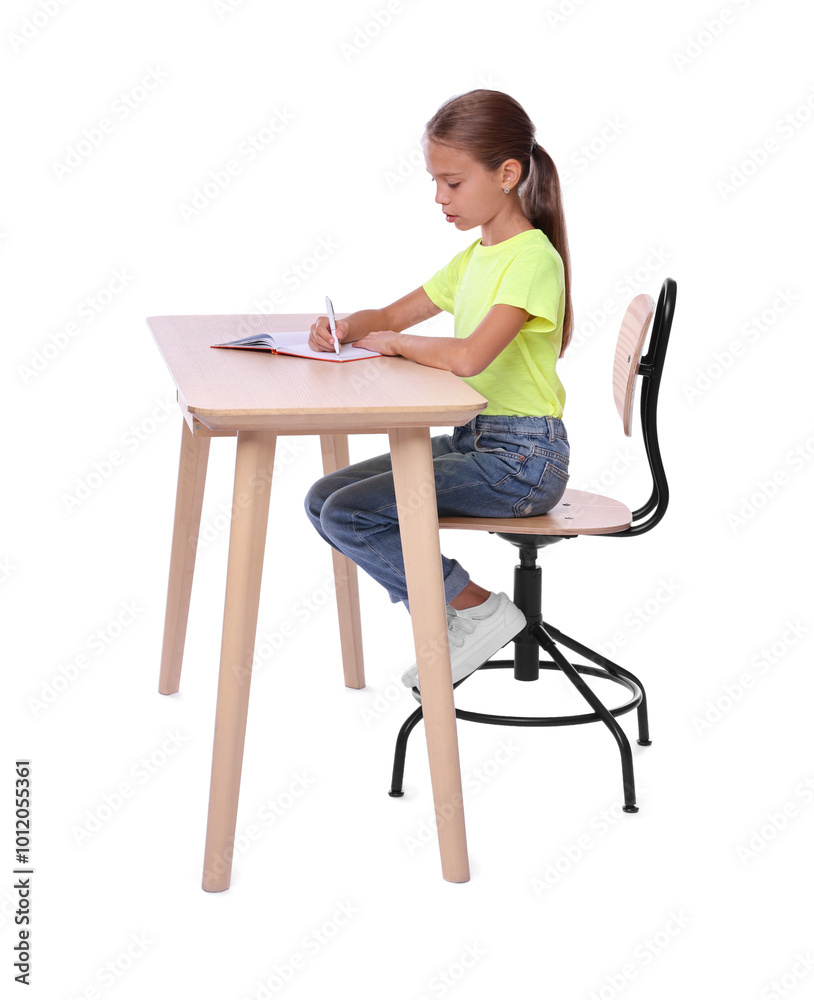 Girl with correct posture and notebook sitting at wooden desk on white background Girl with correct posture and notebook sitting at wooden desk on white background