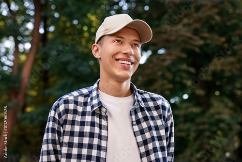 Photography Portrait of smiling man in baseball cap outdoors