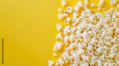 Popcorn on Yellow Background with Copy Space.