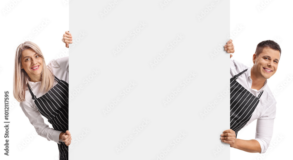 Male and female baristas behind a blank panel Male and female baristas behind a blank panel